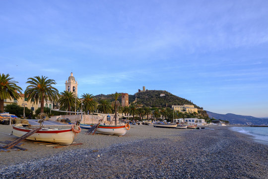 Italy, Liguria, Riviera di Ponente, Noli, fishing boats at beach in the morning light