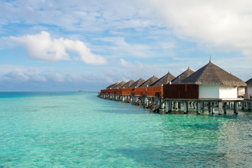 Beautiful tropical Maldives resort hotel and island with beach and sea on sky for holiday vacation.