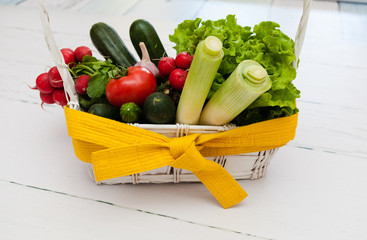 A bouquet of vegetables with a belt 