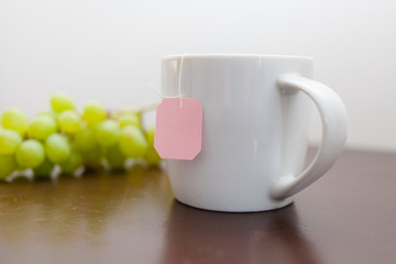 Mug with tea on the table
