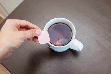 Mug with tea on the table