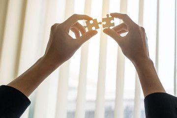 businessmen and jigsaw