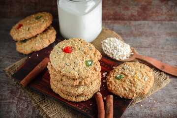 Homemade oatmeal cookies on wooden background