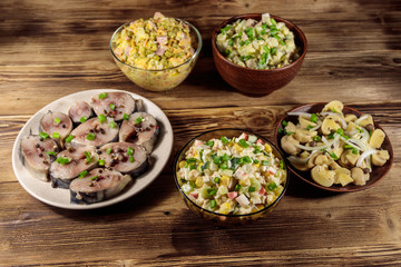 Various festive dishes on wooden table