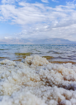 Lowest salty lake in world below sea level Dead sea, full of minerals near luxury vacation resort Ein Bokek, perfect place for medical treatments, climatotherapy, thalassotherapy and heliotherapy.