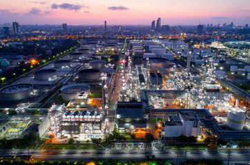 Fototapeta na wymiar Aerial view of twilight of oil refinery ,Shot from drone of Oil refinery and Petrochemical plant at dusk , Bangkok, Thailand