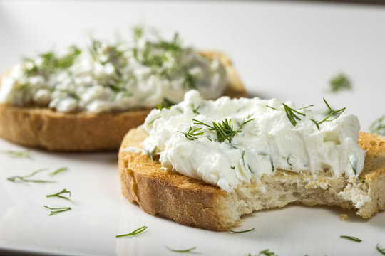 Fototapeta Sandwich with toast and homande cheese cream with fresh dill