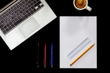 top view of office desk with blank notebook paper pen  © karlibri