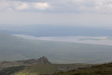 View from the top of the mountain of Big Nurgush to the mountain lake Zyuratkul