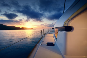 Fototapeta na wymiar Beautiful view to catamaran in Seychelles bay at sunset