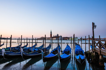 Fototapeta na wymiar Gondolas in Venice, Italy at sunrise