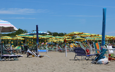 sea beach in summer with umbrellas