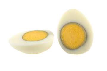 boiled egg peeled sliced on white background