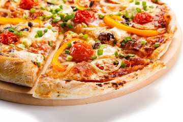 Pizza with ham and vegetables on white background