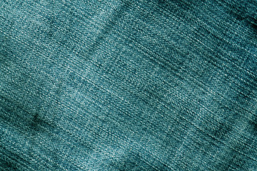 Jeans texture with blur effect in cyan color.