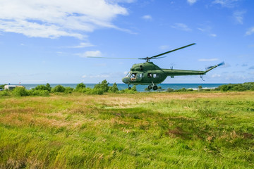Fototapeta na wymiar The military sends a helicopter contract up or down the ground. Helicopter landed. Poland