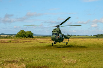 The military sends a helicopter contract up or down the ground. Helicopter landed. Poland