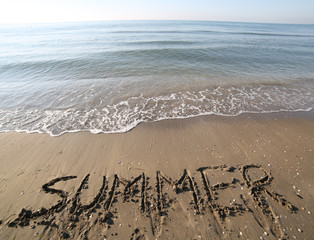 text SUMMER on the sand of the beach