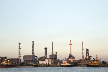 Fototapeta na wymiar Oil and Gas Refinery plant industry factory with river on twilight time