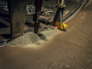 complete automatic submerged arc welding process with flux, wire gun, vacuum and slag.