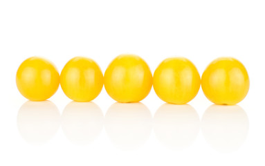 Yellow grape cherry tomatoes isolated on white background five in row.