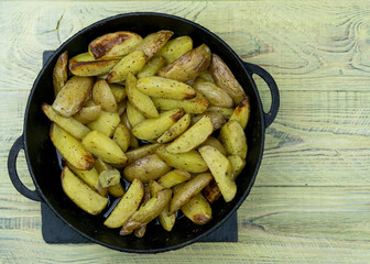 Fried potatoes in a frying pan.