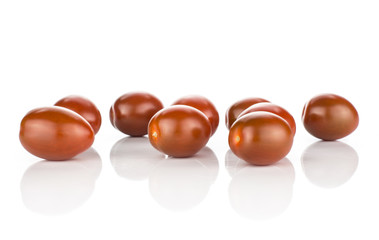 Black red grape cherry tomatoes stack isolated on white background ripe whole.