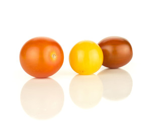 Three grape cherry tomatoes mix isolated on white background yellow black red.