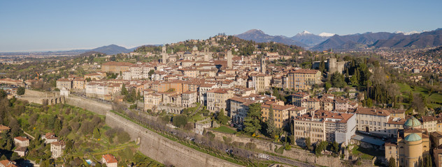 Obraz premium Drone aerial view of Bergamo - Old city. One of the beautiful city in Italy. Landscape on the city center, its historical buildings and towers
