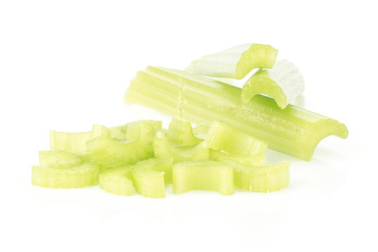 Three fresh green celery sticks and chopped sliced pieces stack isolated on white background.