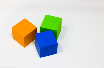 Soft cubes for children of blue, green and orange color