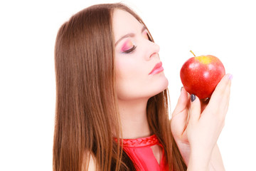 Woman charming girl colorful makeup holds apple fruit