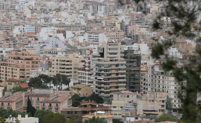 Fototapeta na wymiar Palma de Mallorca, Spain - April 25, 2018 - The city of Palma de Mallorca view from nearby hill of Bellver. Local government will avoid touristic housing rentals in the city from July.