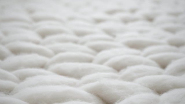 White texture background from merino knitted blanket