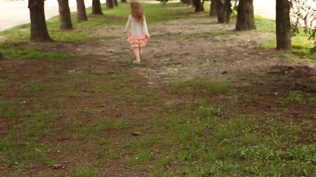 Girl hopping and runs away from camera