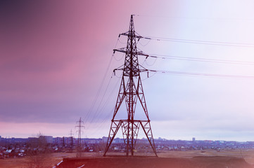  the gap of the high-voltage transmission line against the background of the purple sunset