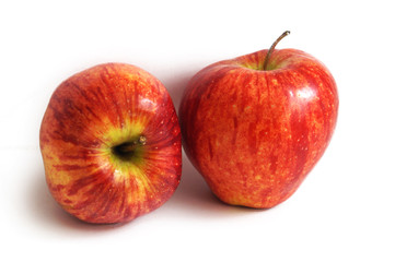 two appetizing red apples on a white background, close-up.
