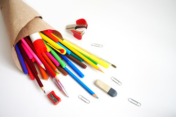 colored pencils, markers, handles, the highlighter, glue, paper clips, the anti-stapler and a...