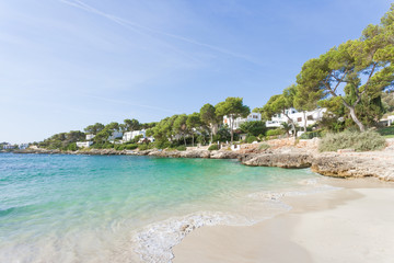 Fototapeta na wymiar Cala d'Or, Mallorca - Smoothe breakers at the beach of Cala d'Or