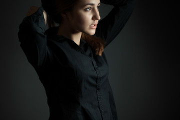 Girl in black shirt. unusual composition