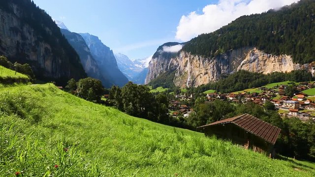 View of alpine fresh green meadows. Location Lauterbrunnen valley, Swiss alps, Europe.