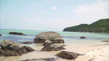  Large rocks in the ocean. Large stones on the beach in the sea.