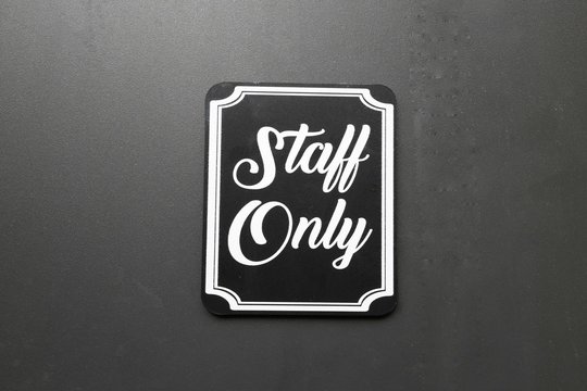 staff only plate on the door