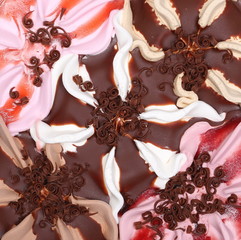 Chocolate, vanilla and raspberry ice cream with sprinkles background and texture 