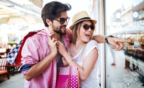 Shopping time. Young couple in shopping. Consumerism, love, dating, lifestyle concept