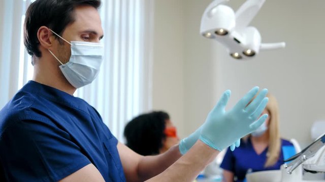 Dentist and his assitant working in private practice.
