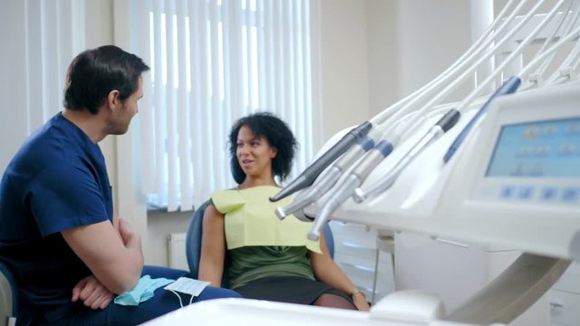 Man dentist and his pacient in private practice.