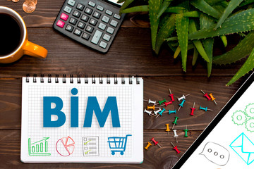 Notebook with a notes BIM on the office table with tools