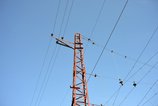 An electric pole made of metal on a railway to transmit power to trains.