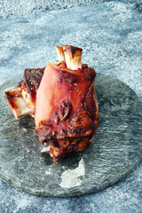 Fototapeta na wymiar Roasted pork knuckle. Ham and bacon are popular foods in the west. German Schweinshaxe or Haxe